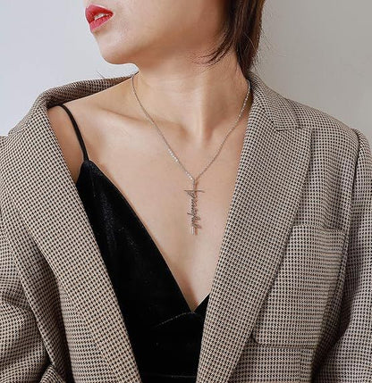 Faith cross pendant necklace on a woman's neckline with delicate silver chain