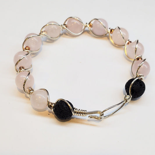 Rose quartz and black lava rock wrap bangle bracelet with metal spiral wire links and clasp