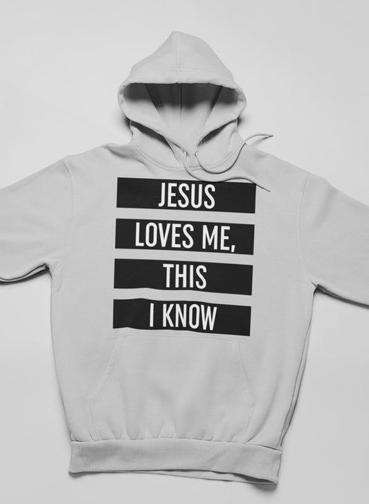Light gray hoodie with bold front text "JESUS LOVES ME, THIS I KNOW" and hood.