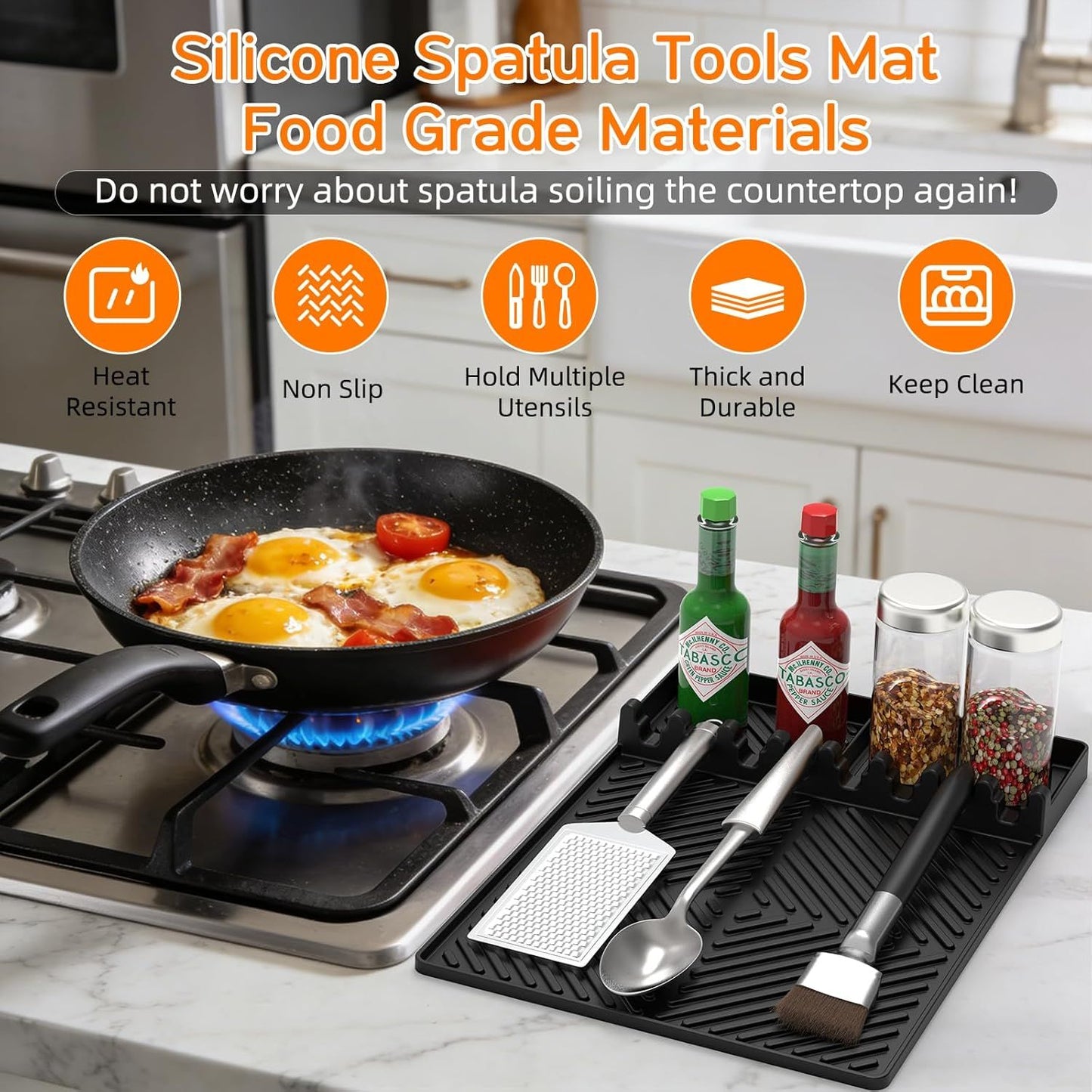 Orange silicone tools mat with textured grip, holding spatulas and drip pad