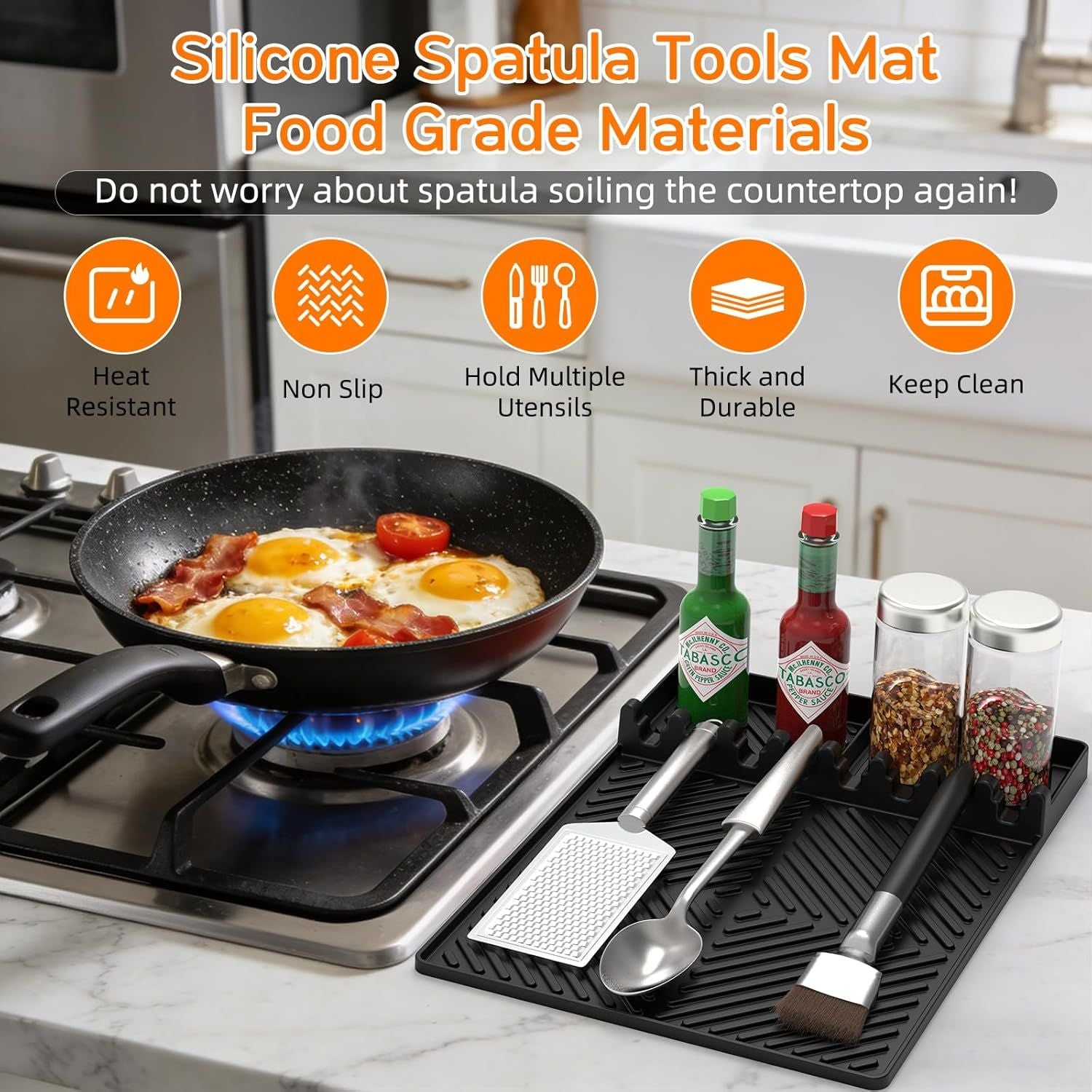 Orange silicone tools mat with textured grip, holding spatulas and drip pad