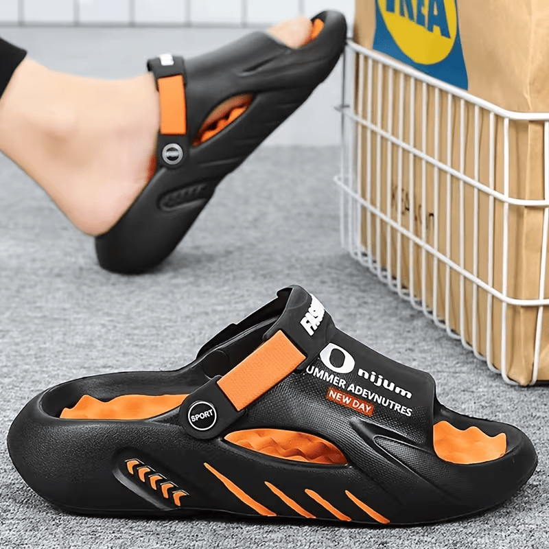 Black EVA clog sandals with orange accents and adjustable strap, vented upper