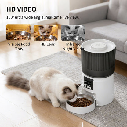 White and dark gray smart pet feeder with stainless food bowl open, cat pawing at food