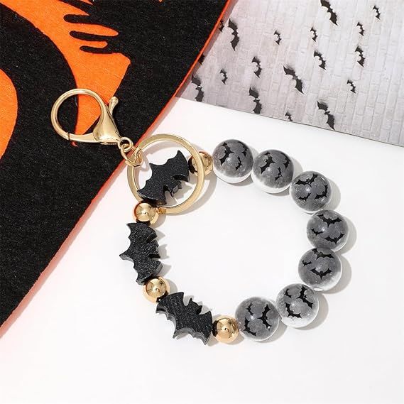 Halloween bat and skull beaded keychain ring with dark gray beads and gold accents