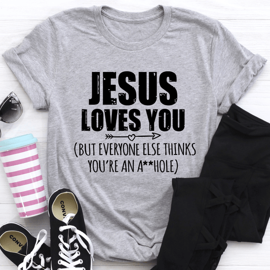 Heather gray graphic crewneck t-shirt with centered "JESUS LOVES YOU" text and verse line