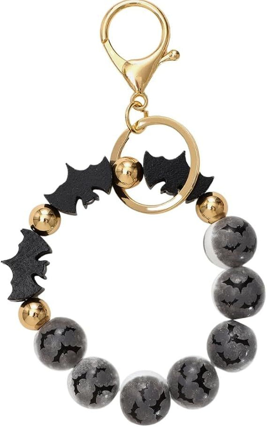 Halloween beaded keychain ring with black bat charms and dark gray skull beads