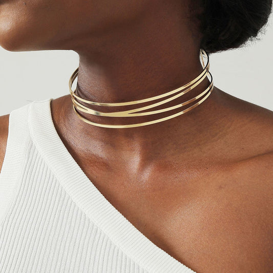 Golden stackable hollow choker necklace with multiple slim metal bands