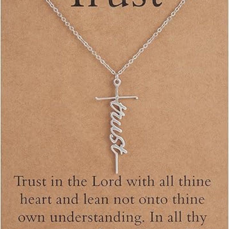 Silver cross pendant necklace with Trust script charm on a chain