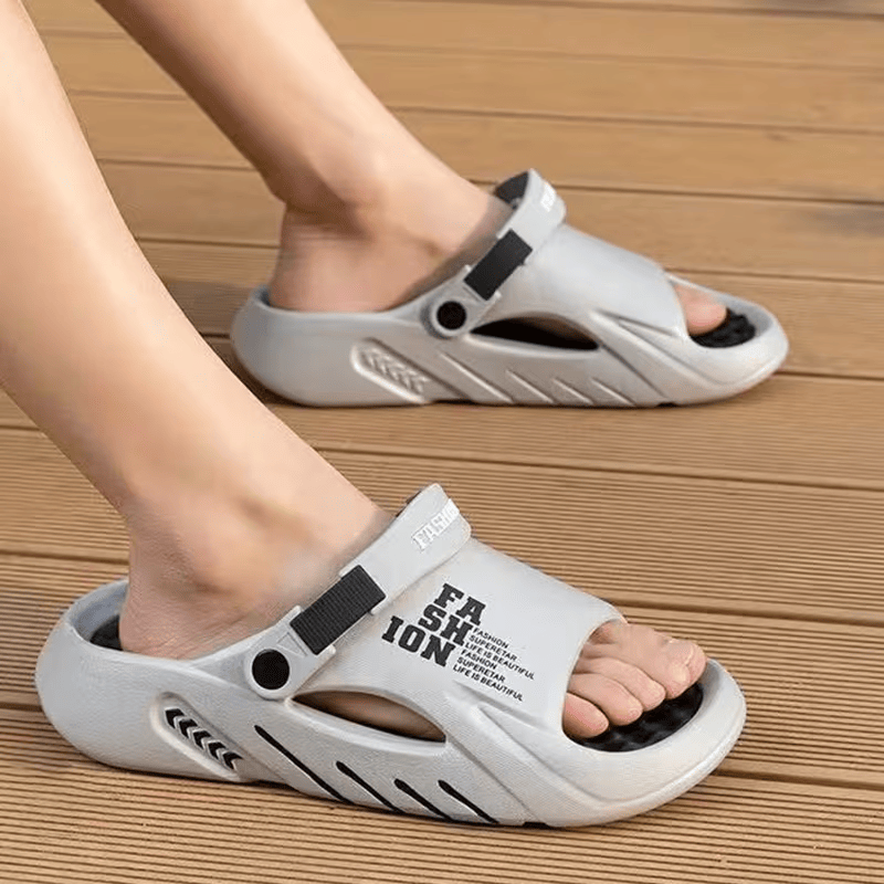 White platform EVA clog slippers with black back strap and cutout hole design