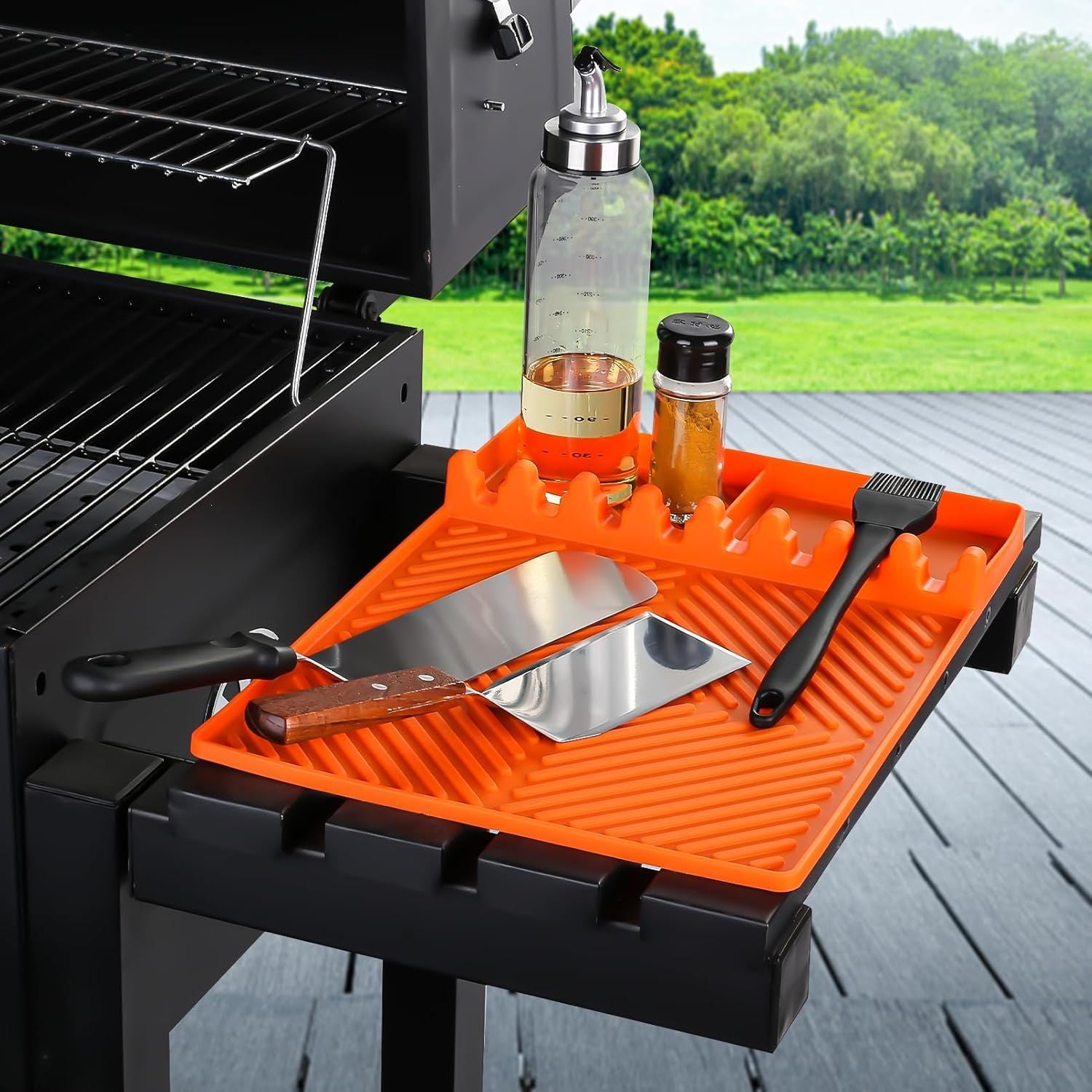 Orange silicone tools mat with ribbed slots and drip pad for grill utensils