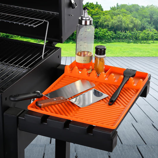 Orange silicone tools mat with ribbed slots and drip pad for grill utensils