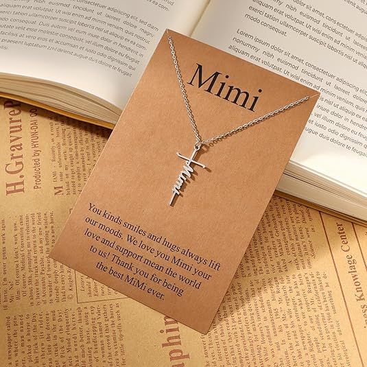 Religious cross and 'Mimi' script pendant necklace on a fine linked chain