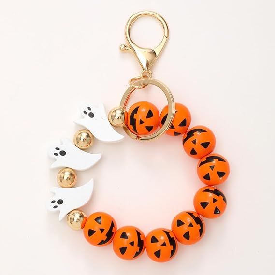 Halloween beaded keychain with orange jack-o-lantern beads and white ghost paw charms