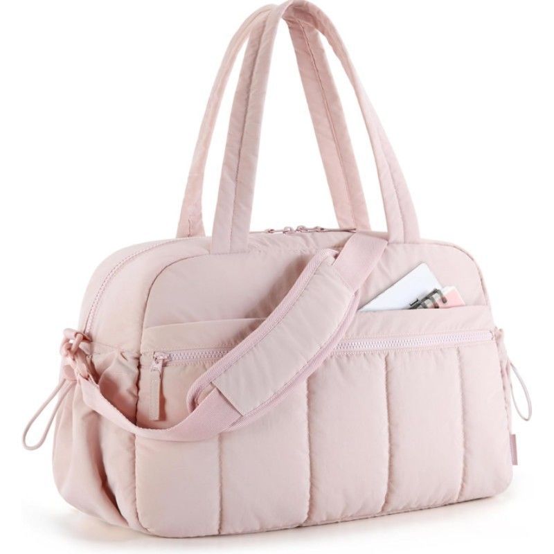Pink quilted shoulder travel tote bag with front zip pocket and side drawstring