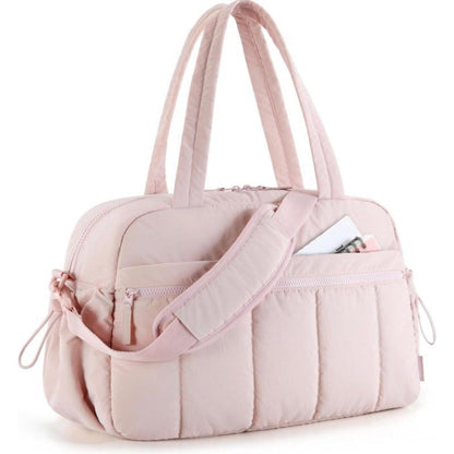 Pink quilted shoulder travel tote bag with front zip pocket and side drawstring
