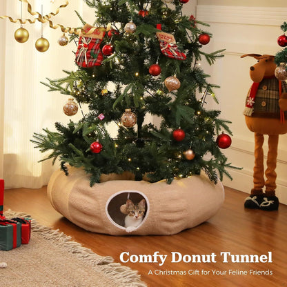 Beige donut cat tunnel bed with circular entrance and plush interior, cat resting inside.