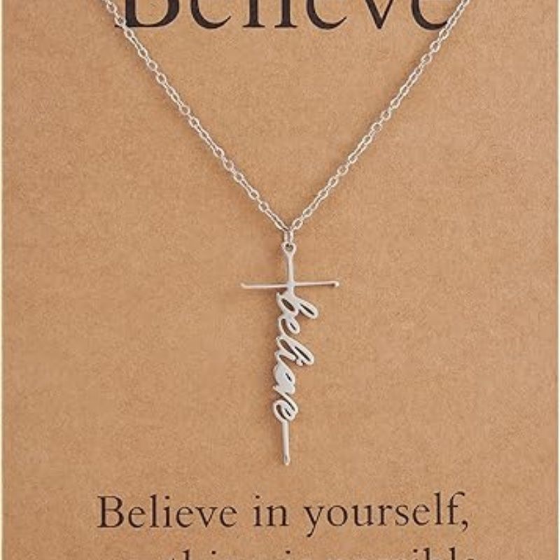 Silver cross pendant necklace with Believe script charm on a chain