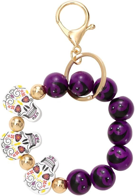 Halloween beaded keychain ring with purple beads and cartoon bat and pumpkin charms
