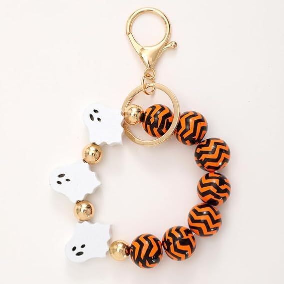 Halloween beaded keychain with orange and black zigzag beads and white ghost charms