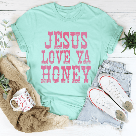 Mint green crew-neck T-shirt with centered pink 'JESUS LOVE YA HONEY' graphic