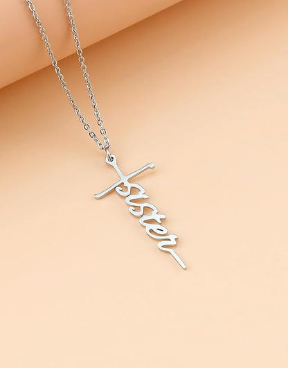 Cross pendant necklace with a cursive word charm on a silver-tone chain
