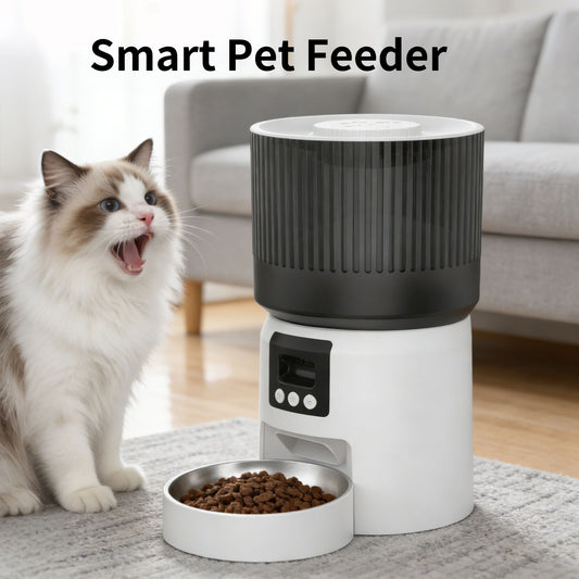 White and dark gray automatic pet feeder with open stainless bowl and kibble, cat nearby