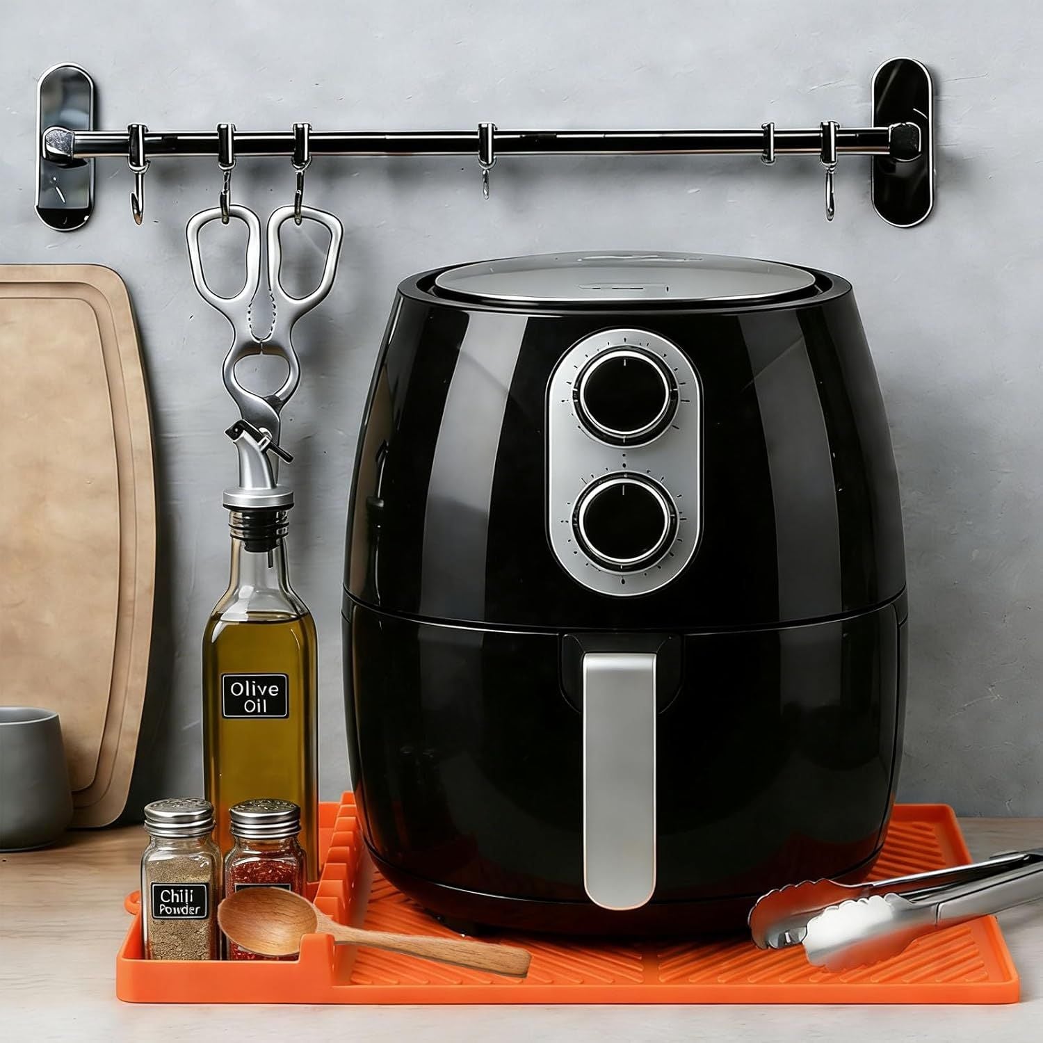 Orange silicone tools mat with drip pad, griddle spatula slots and utensil holders