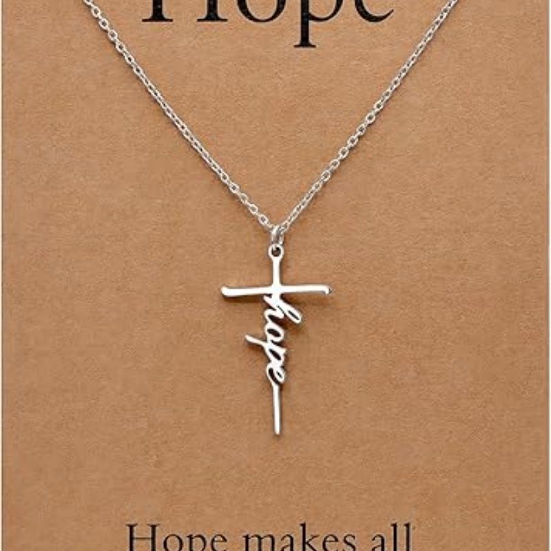 Silver cross pendant necklace with Hope script charm on a chain