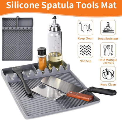 Gray silicone spatula tools mat with utensil slots and built-in drip compartments
