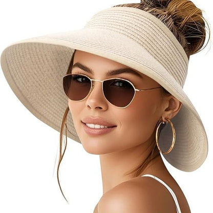 Women’s wide-brim paper straw sun hat in light tan with ponytail opening, packable design