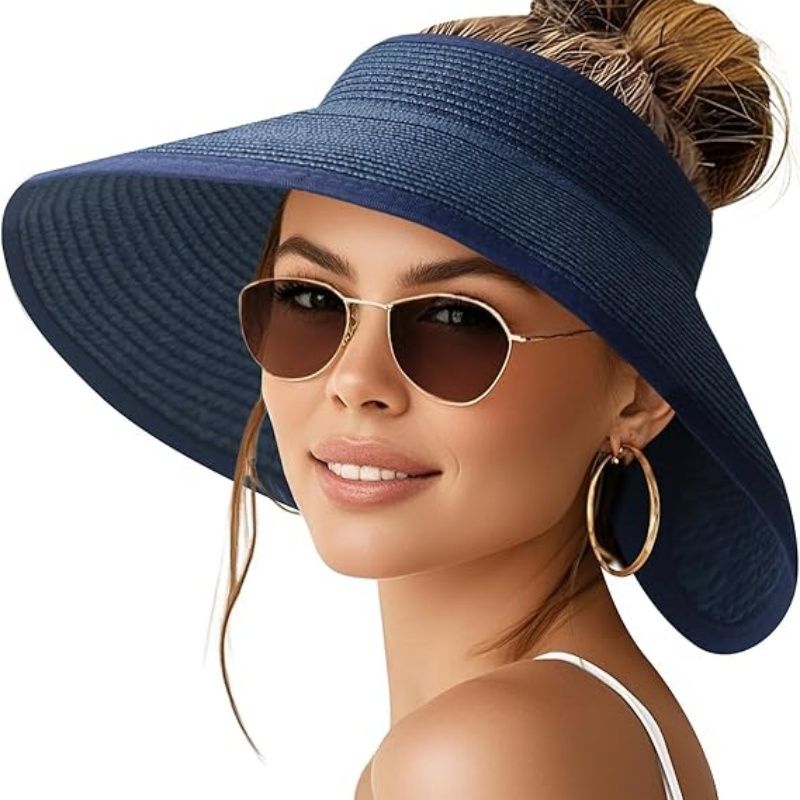 Women’s wide-brim paper straw sun hat in navy blue with ponytail opening, floppy brim