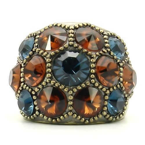 Antique brass ring front view with blue center crystal, orange side stones, and beaded trim