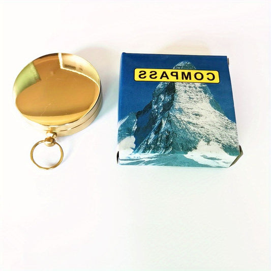 Vintage copper pocket compass with flip lid and keyring, closed case.
