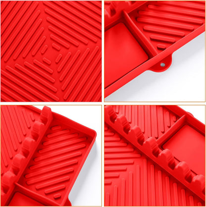 Red silicone tools mat close-up with ridged drip channels and corner utensil-rest pegs.