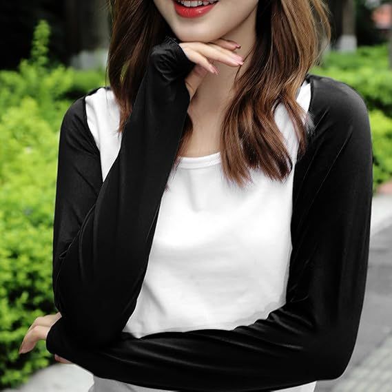 Black long-sleeve cooling shawl/shrug with V-shaped opening, worn by a woman.