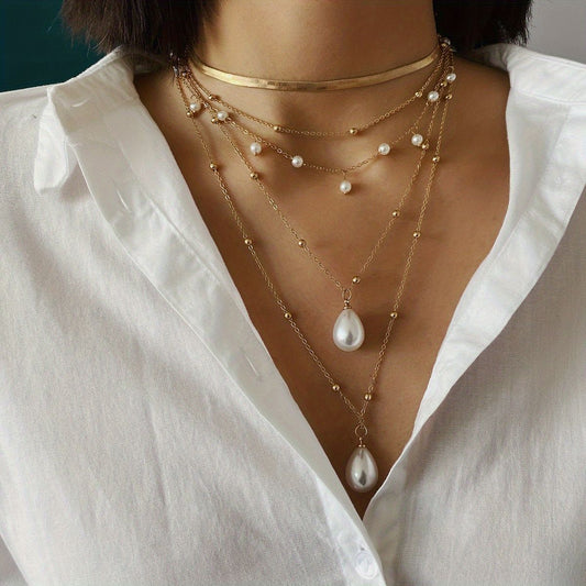 Golden multilayer chain necklace set with faux pearl drops and tassel-like beads