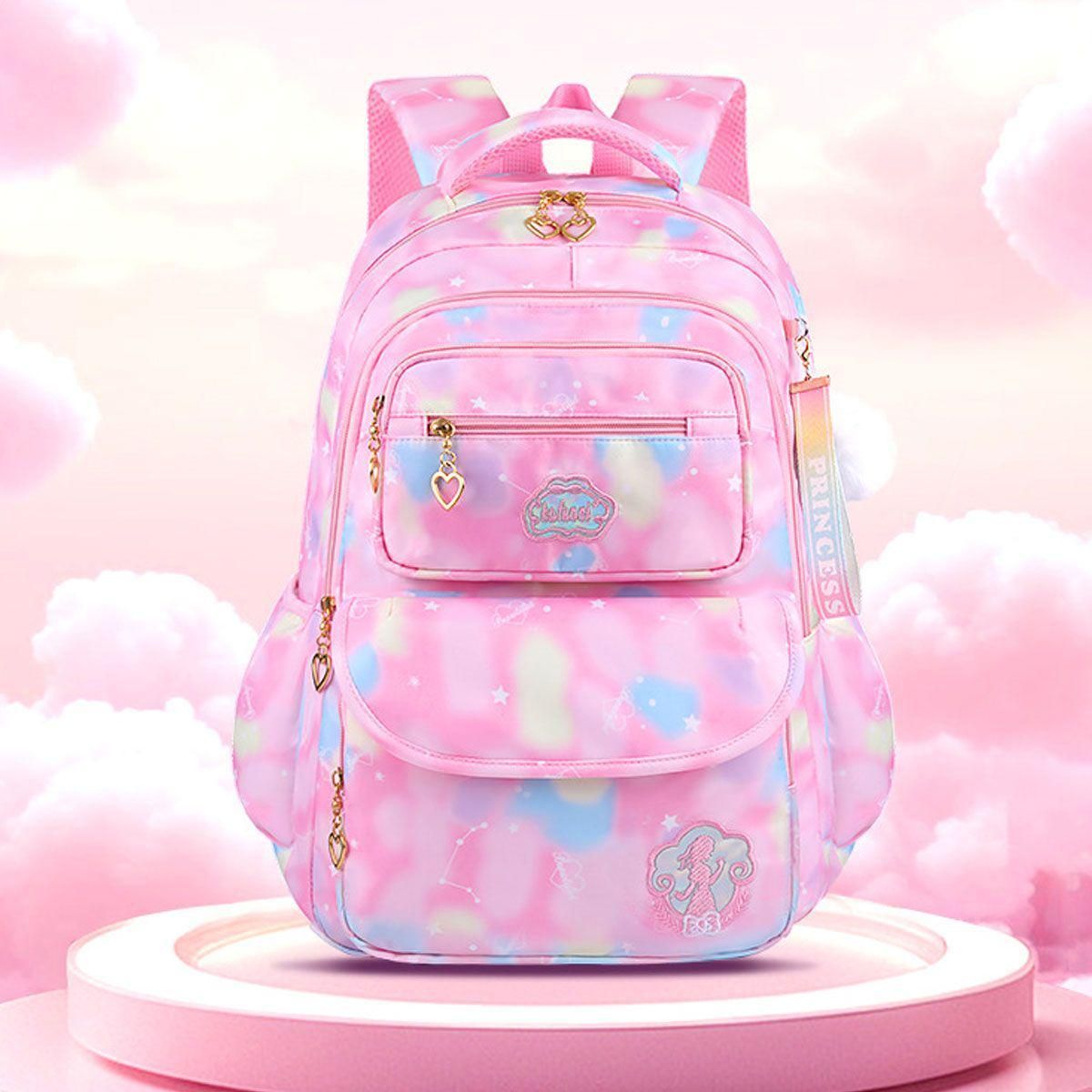 Pink gradient children's backpack with front zip pocket and heart charm accents