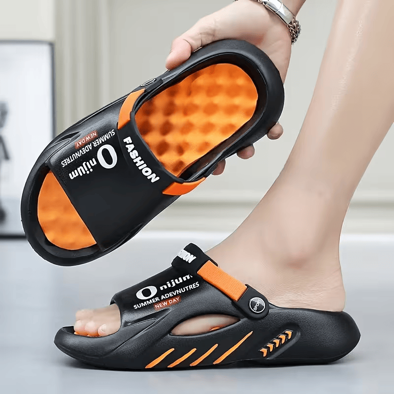 Black EVA platform clog sandal with adjustable strap and breathable open interior.