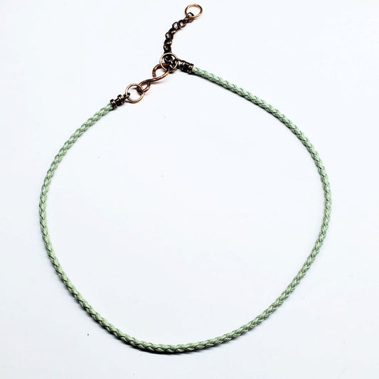 Braided cord autism awareness puzzle piece pendant necklace, green cord with metal bail