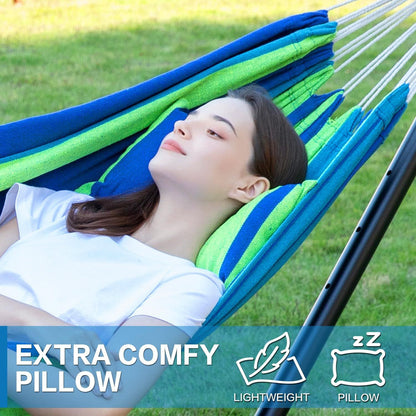 Double hammock with stand, blue and green striped hammock with person reclining