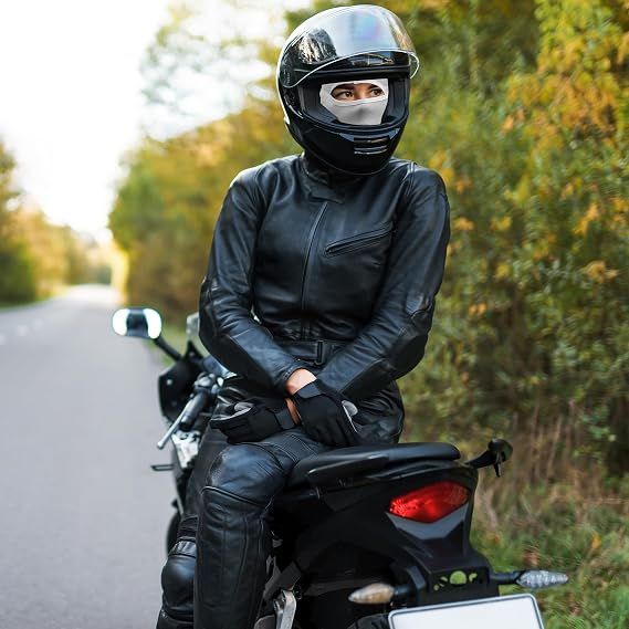 Black full-face balaclava with oval eye opening worn under a helmet