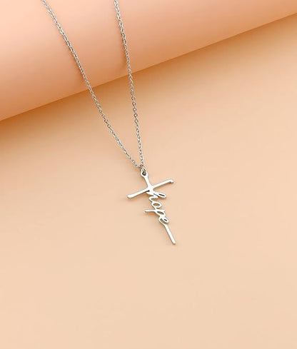 Silver cross pendant necklace with cursive charm and chain