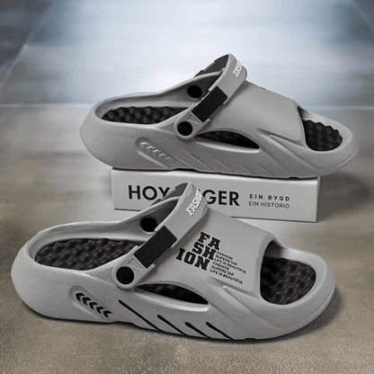 Light gray EVA clog sandals with adjustable strap and open breathable ventilation holes.