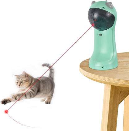 Teal automatic laser cat toy with red laser dot and beam, near lounging gray cat