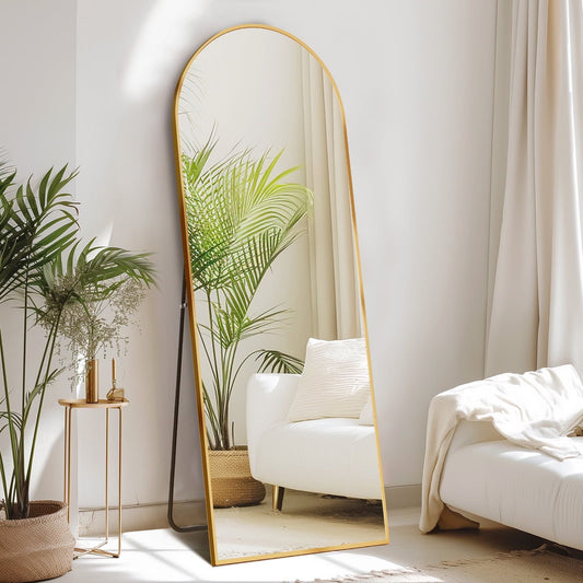 Arched full-length standing mirror with gold frame and clear reflection, slim profile