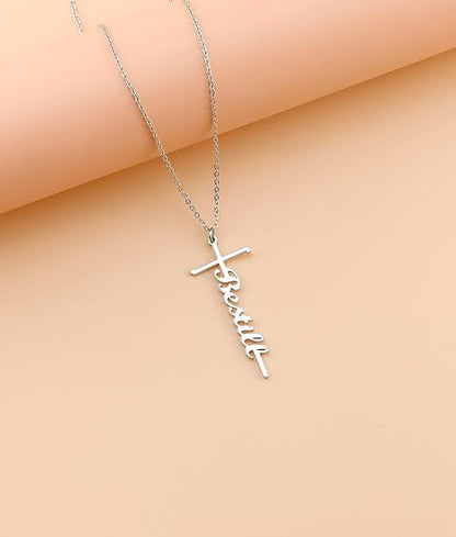 Silver-tone cross with cursive faith pendant on a fine chain necklace