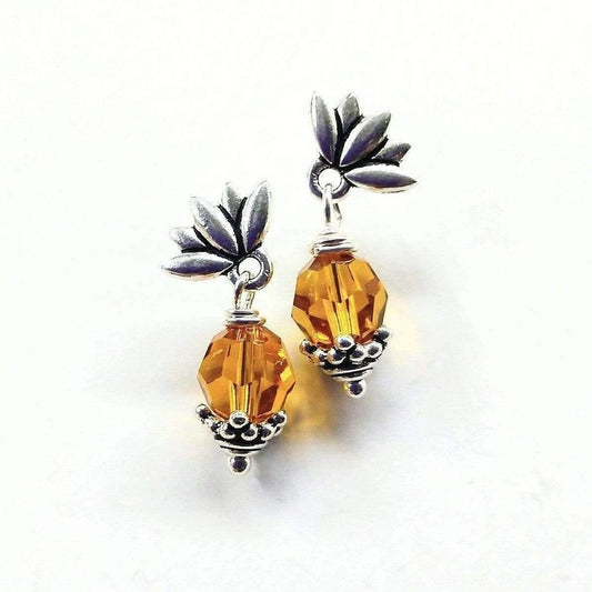 Sterling silver crystal drop stud earrings with amber teardrop and purple flower tops
